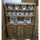 An antique pine Kitchen Dresser, with an open plate rack, comprising two shelves fitted with