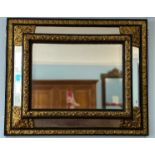 An early 20thC ornate rectangular five-plate bevelled edged Wall Mirror, the frame formed of