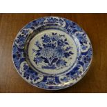 A 20thC Dutch Delft blue and white floral Wall Plate, signed, bearing original paper label for W. A.