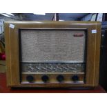 A retro Pye Model P76F Radio, the 1950s radio in walnut casing, with original Instruction Manual and