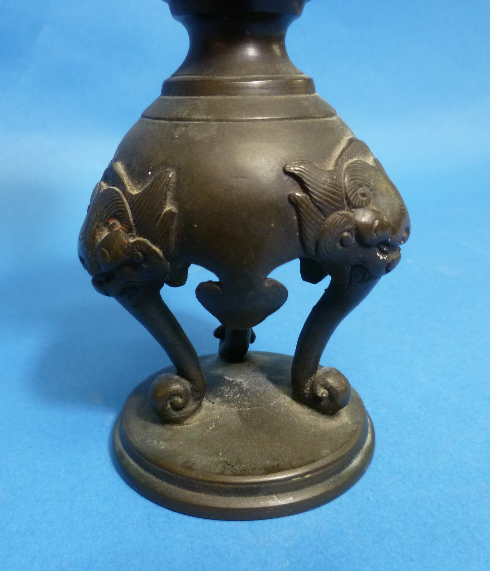 An antique Oriental bronze Candlestick, embossed in relief with three-toed dragons, dogs of Foo, - Image 2 of 4