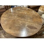 An antique fruitwood circular plank tilt-top Table, 33in diameter x 27in high (84cm x 69cm)