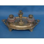 A Victorian silver-plated and cut glass Inkstand, of oval form, the two ink pots flanking a taper