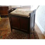 An antique Piano Stool, with upholstered seat, 22½in (57cm) wide x 25in (63.5cm) high.