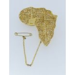 An 18ct filigree gold 'Map' Brooch of Africa, with gold highlight for 'Nigeria', with