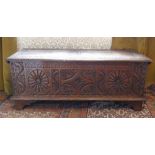 An antique carved oak Coffer, 47in (119.5cm) wide x 17½in (44.5cm) deep x 19½in (49.5cm) high.