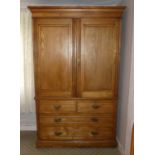 An antique Linen Press, 52in (132cm) wide x 82in (208cm) high x 21in (53.25cm) deep.