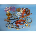 A collection of Costume Jewellery, including a Hollywood brooch, various other necklaces, pendant,