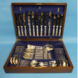 An oak cased silver plated Canteen of Cutlery, Kings Pattern, six place setting, lacks carving