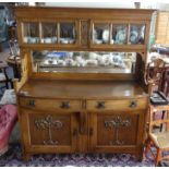 An Arts and Crafts oak Sideboard in the manner of William Cowie for Shapland and Petter, the upper