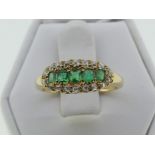 An attractive emerald and diamond Ring, the centre set with five emeralds, with yellow gold