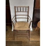 A late 19thC beech Sussex Elbow Chair, the ladder back with spindle gallery to top rails, above