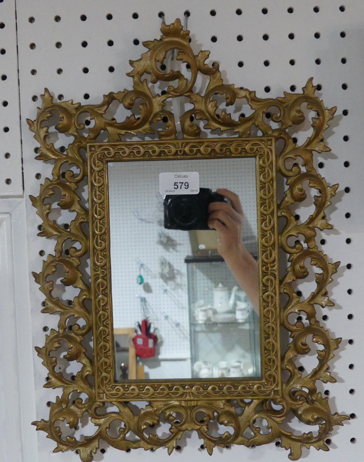 An early 20thC Rococo-style Mirror, the rectangular mirror plate enclosed in pierced scroll and