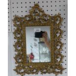 An early 20thC Rococo-style Mirror, the rectangular mirror plate enclosed in pierced scroll and