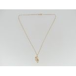 An 18ct gold Mikimoto cultured pearl Pendant and Chain, the cultured pearls mounted one above the