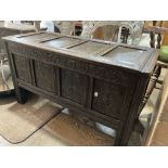 A 17thC style oak Coffer, the front with four carved panels, 39in wide x 16½in deep x 22in high (