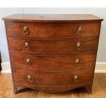 A Georgian mahogany bow-front Chest of Drawers, the top with boxwood stringing above the four long