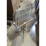 An antique brass and mahogany Magazine Rack, the three brass and mesh dividers on mahogany board,