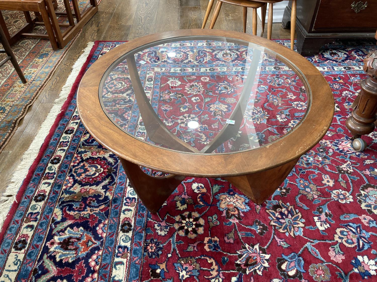 A retro G-Plan Astro teak and glass topped circular Coffee Table, 33in (84cm) diameter.