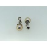 A pair of 18ct white gold and cultured mabe pearl Earrings, the pillar and clip fittings