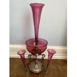 An Edwardian cranberry glass and silver plated Epergne, with a central trumpet vase and bowl