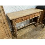 An early 20thC pine two-drawer Side Table, 46½in wide x 19in deep x 31in high (118cm x 48cm x