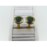 A pair of 14k gold and jade Cufflinks, the fronts with a circular jade disc in pierced gold mount,