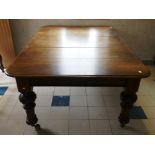 A Victorian mahogany extending dining table, with one additional leaf, 70in (178cm) long x 48in (