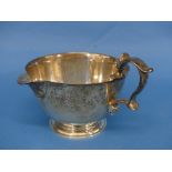 An Elizabeth II silver Cream Jug, by JCL, with retailers mark for Bruford's of Exeter, hallmarked
