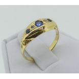 A small sapphire and diamond boat shaped Ring, the small graduated sapphires with a diamond point
