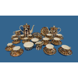 Royal Crown Derby; a 35-piece bone china tea and coffee service, decorated in the Imari palate