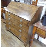 A Georgian mahogany Bureau, the interesting veneered top enclosing fitted interior with ebony and