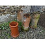 Three vintage terracotta Pipes, 25in high x 10in diameter (63.5cm x 25.5cm) and another similar,