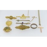 A collection of 9ct yellow Gold, including a Royal Artillery brooch, a heart shaped locket, a