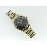 An Omega Seamaster gents gold-plated bracelet Wristwatch, with black dial and gilt baton hour