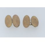 A pair of 9ct rose gold oval Cufflinks, with chain between, approx total weight 5.8g.
