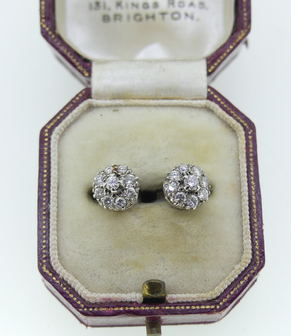 A pair of small diamond cluster Ear Studs, the central stone with eight diamonds around, all mounted - Image 2 of 2