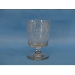 An early 19th century Masonic glass Rummer, the bucket-shaped bowl engraved with Masonic symbols and