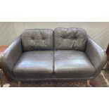 A modern leather retro style Two Seater Sofa, by John Lewis, the button-back in grey leather uphols