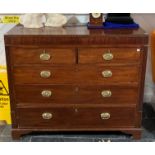 A George III mahogany Chest of Drawers, the rectangular top with geometric inlaid edge above two