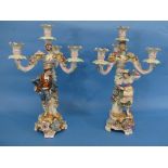 A pair of late 19th century continental porcelain figural Candelabra, modelled as dancers before