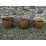 Three earthenware Plant Pots, one cracked, 19in diameter x 17¼in high (49cm x 44cm) (3) Note; This