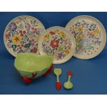 A pair of Poole pottery floral Chargers, 12¼in (31cm) diameter, and another similar, smaller,