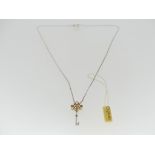 Clogau Gold; A silver and gold Key Pendant, with a 9ct yellow gold filigree top set with three small