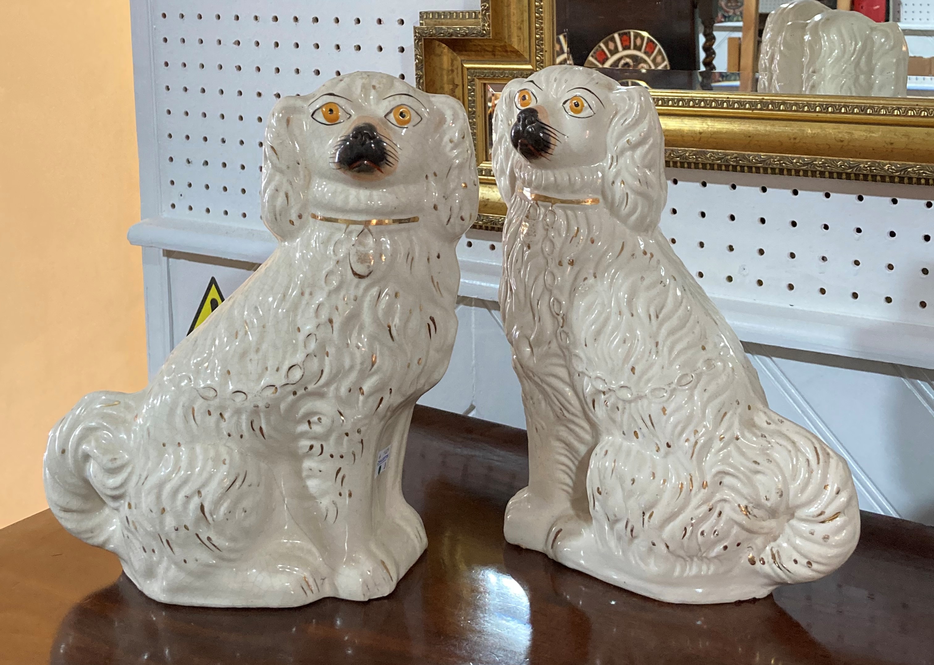 A pair of Staffordshire pottery Spaniel dogs, approximately 12in (30.5cm) high, together with an