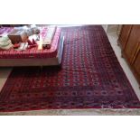 An Afghan Belouch Carpet, 154in (391cm) long x 112in (284.5cm) wide.