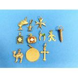 A collection of eleven 18ct yellow gold Charms / small Pendants, eight marked including Maltese