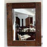 A rustic-style rectangular oak wall Mirror, the large distressed oak frame interspersed with metal