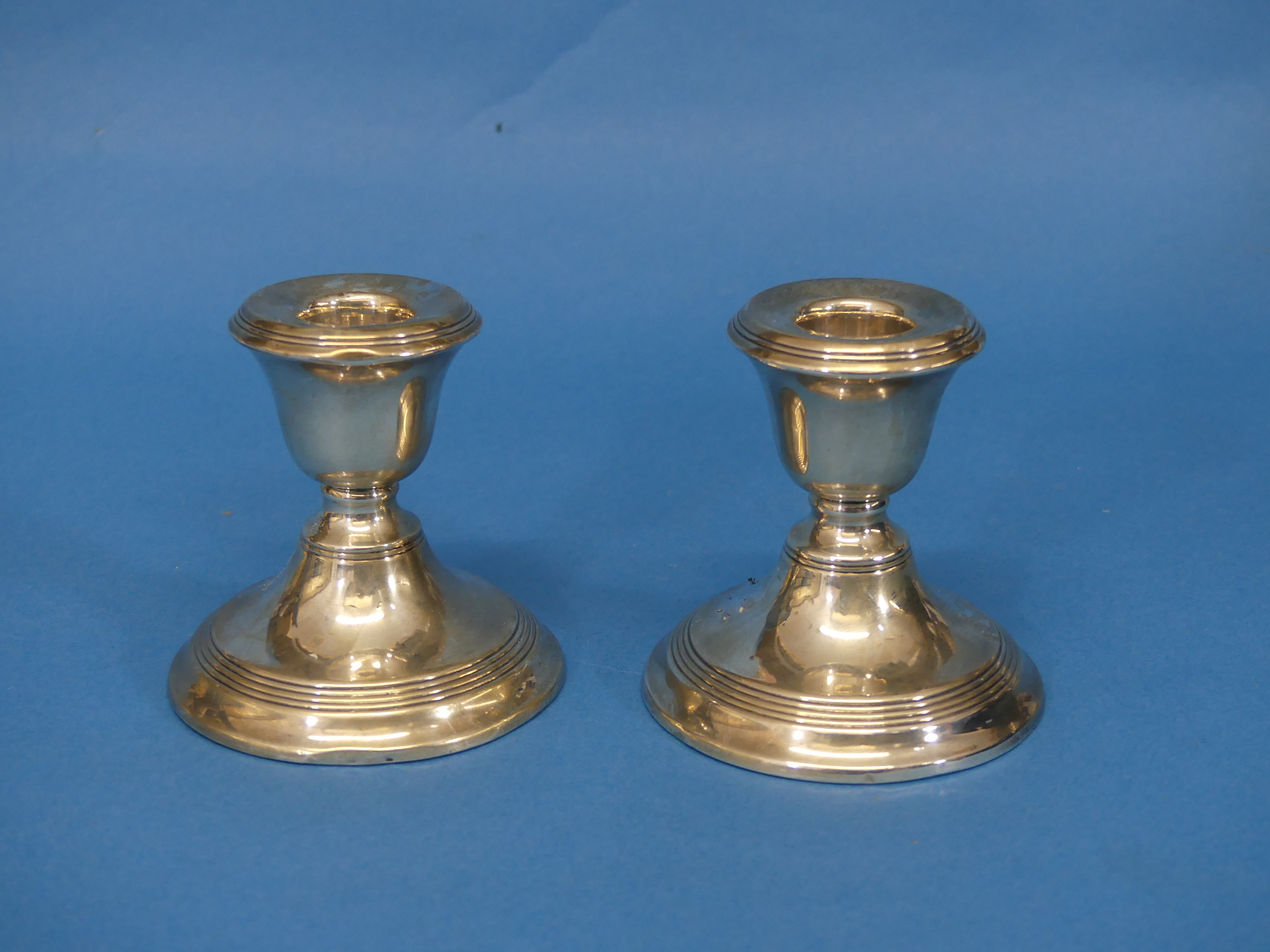 A pair of George VI short silver Candlesticks, by Joseph Gloster Ltd., hallmarked Birmingham,