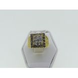 A diamond Dress Ring, the front set with a central square of three rows of three diamonds, with a